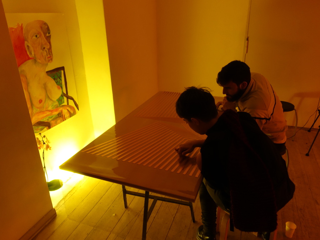 Visitors engaging with the work